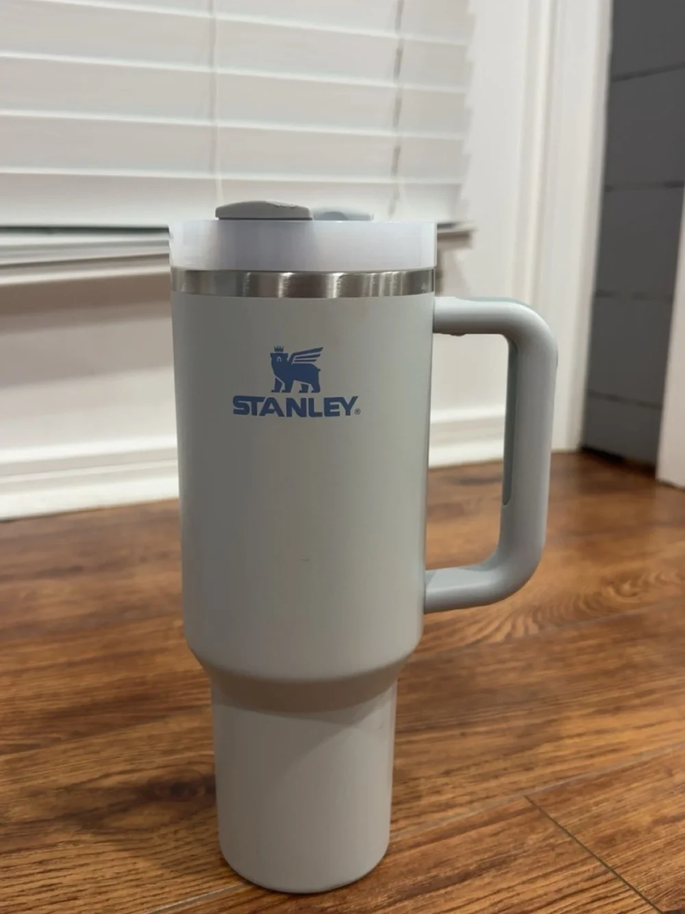 Stanley Pale Gray Travel Mug with Handle and Blue Logo